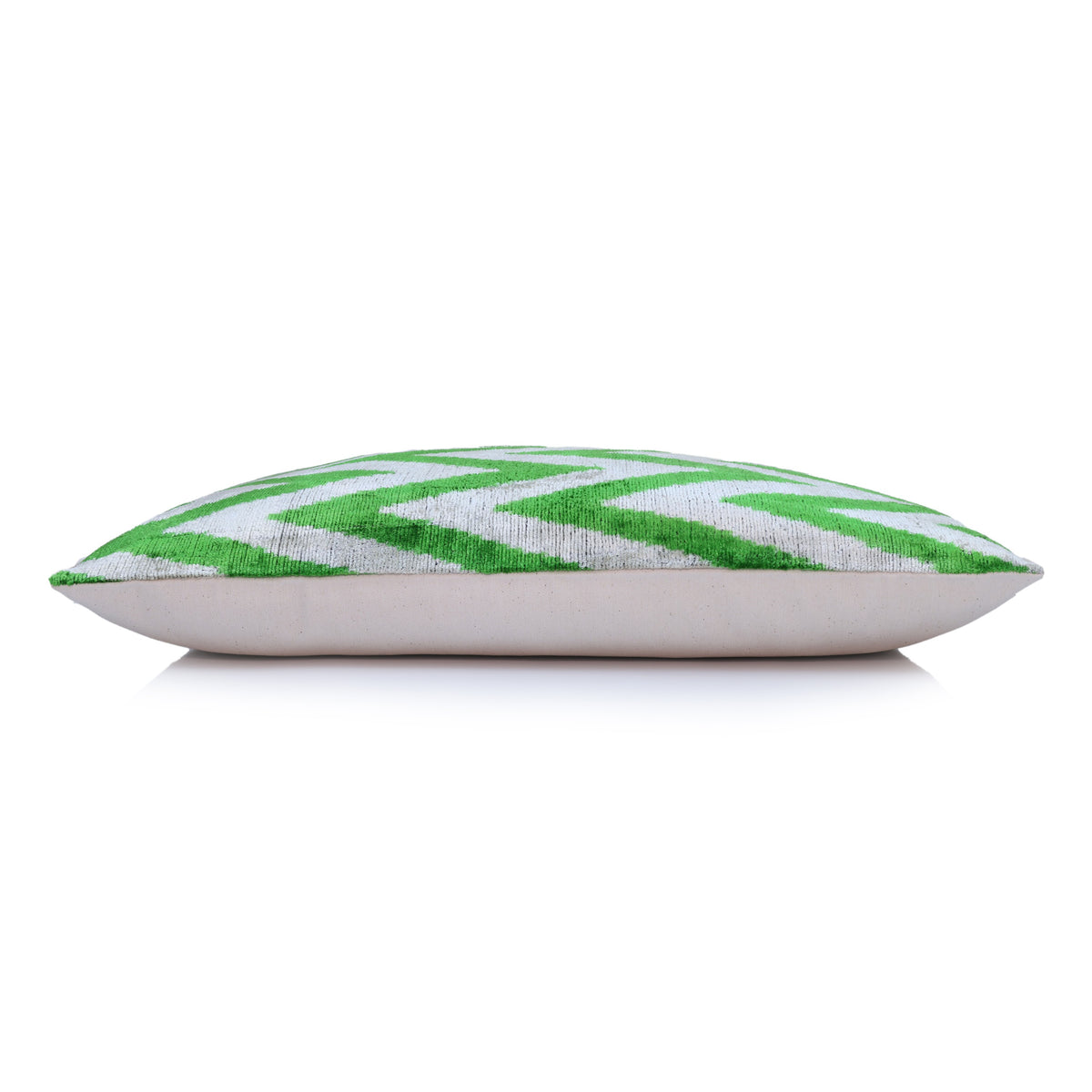 Side profile showing the lumbar pillow depth, velvet front and linen back