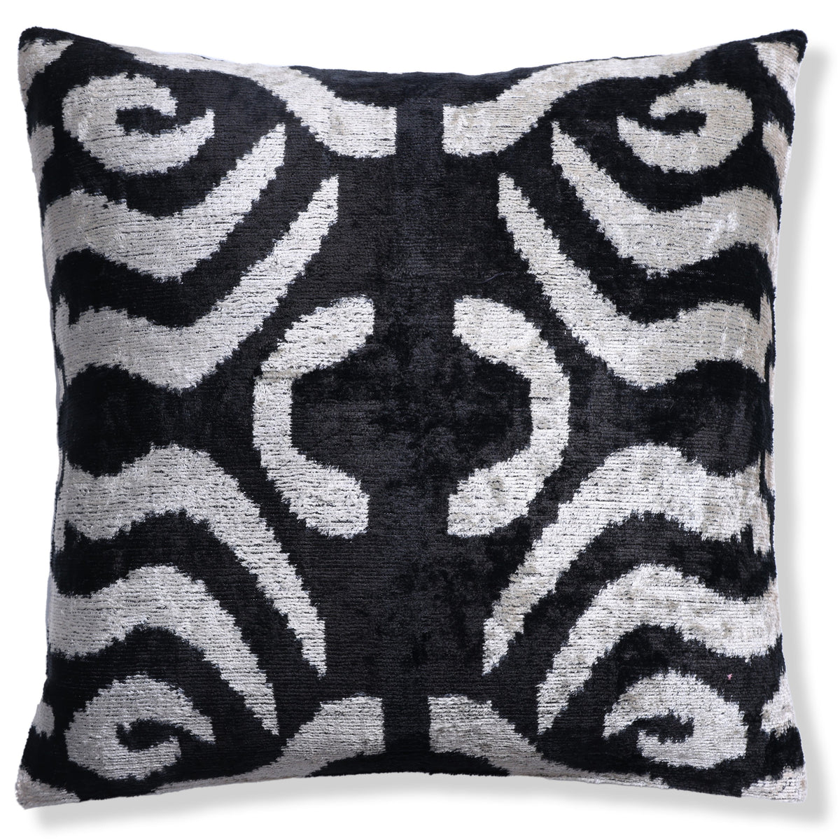 Full front view of a square black and ivory ikat velvet pillow on white