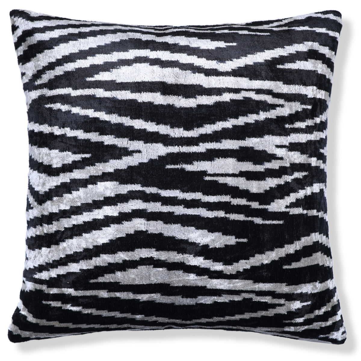 Full square throw pillow in inky black and soft ivory zebra-inspired ikat velvet