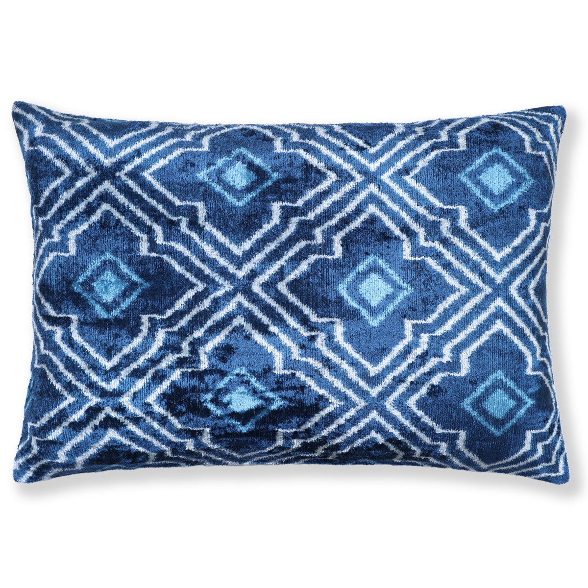 Medium denim blue and white geometric diamond trellis lumbar pillow on a white background