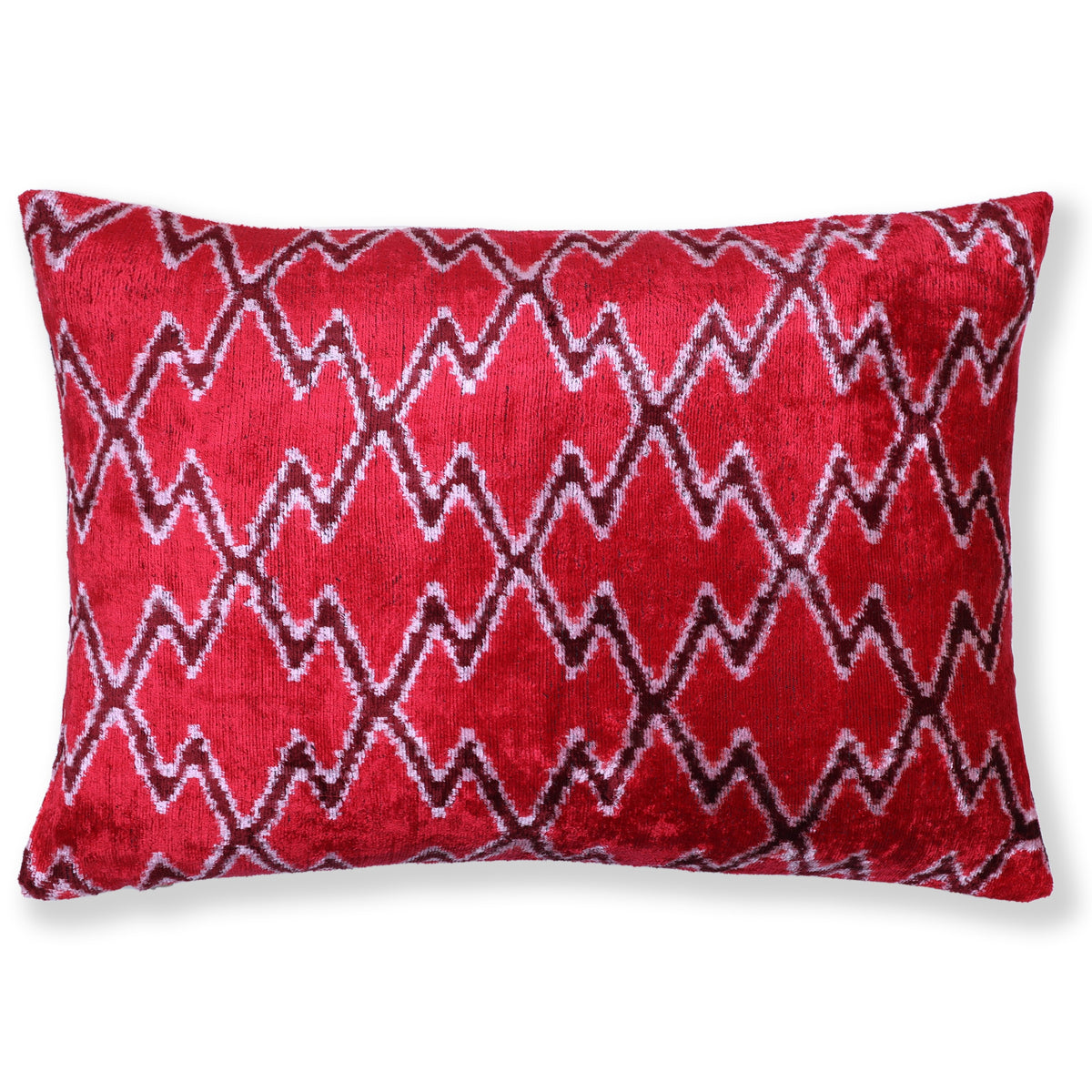 Cherry red and off-white ikat zigzag diamond pattern on a silk velvet lumbar pillow