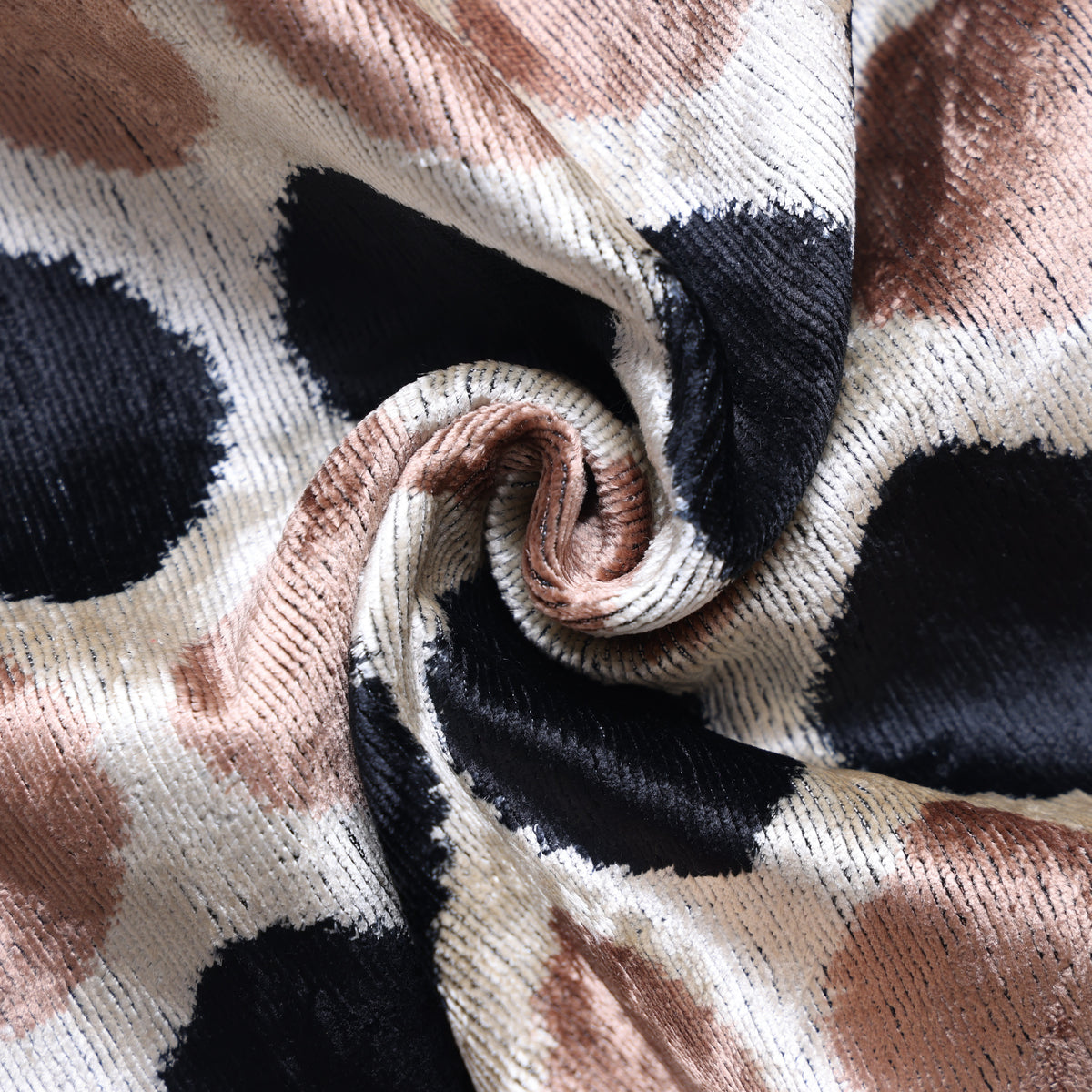 Close-up of light champagne beige silk velvet showing soft folded texture