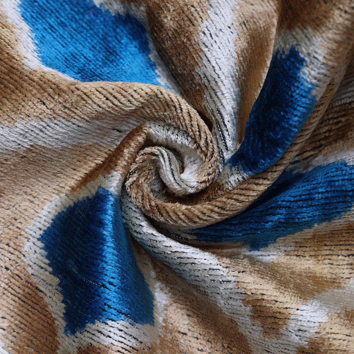 Close-up of golden taupe silk velvet showing plush texture and shimmering sheen