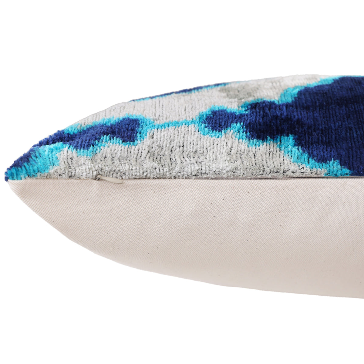 Close-up of the hidden zipper seam on the ikat silk velvet pillow