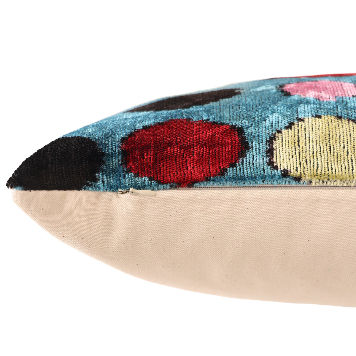 Hidden zipper along the bottom edge of the cerulean blue polka dot pillow