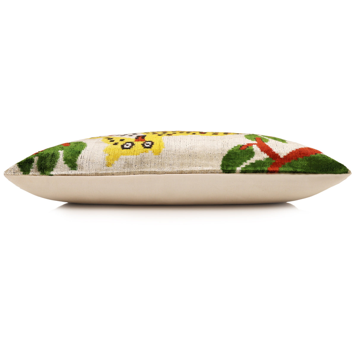 Side profile of lumbar pillow with plain linen backing and plush velvet front