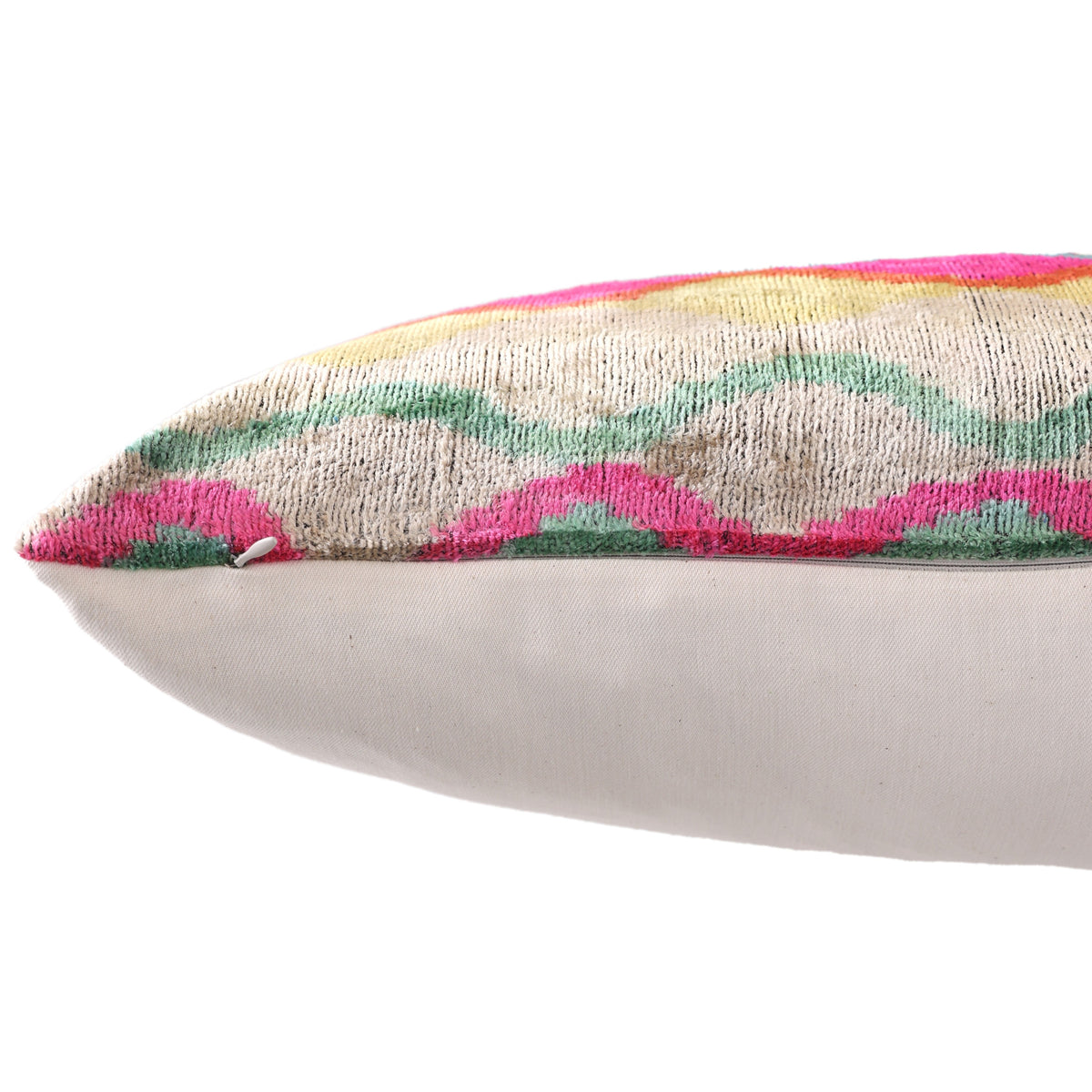 Side seam close-up showing hidden zipper on multicolor wavy ikat lumbar pillow