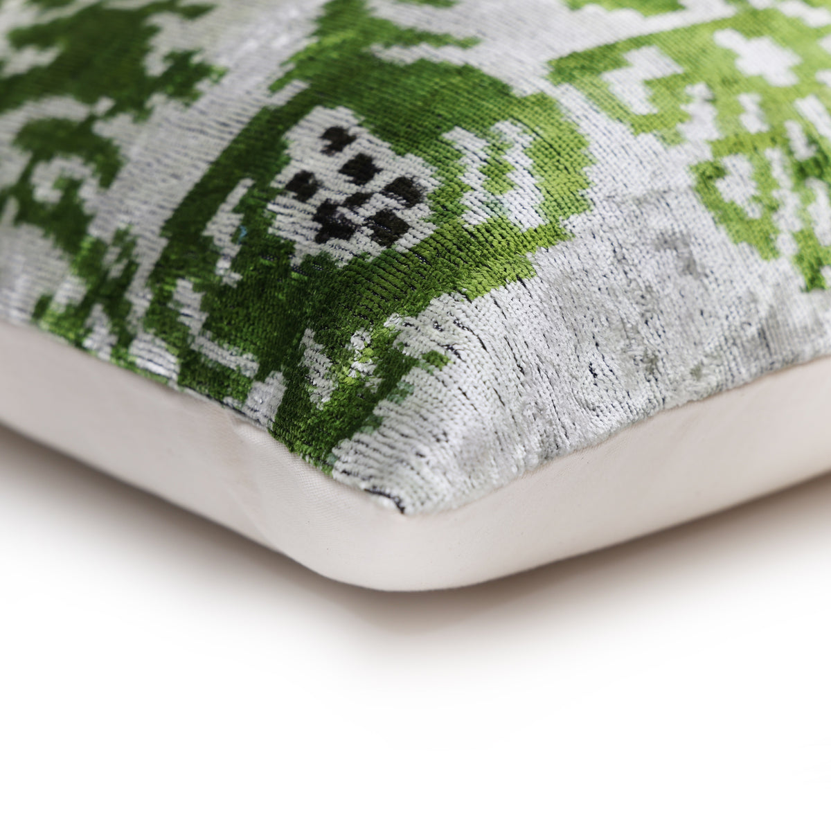 Corner view shows the pomegranate pattern and solid backing seam