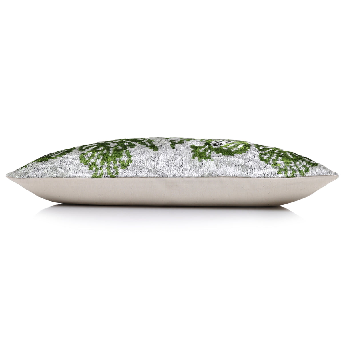 Side profile shows the lumbar pillow loft and backing edge