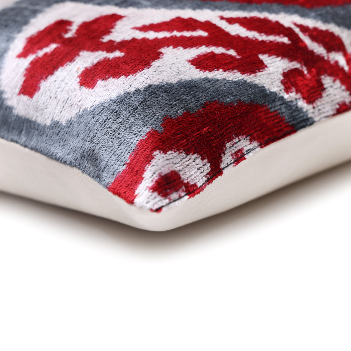 Corner detail where the patterned velvet face meets the solid backing