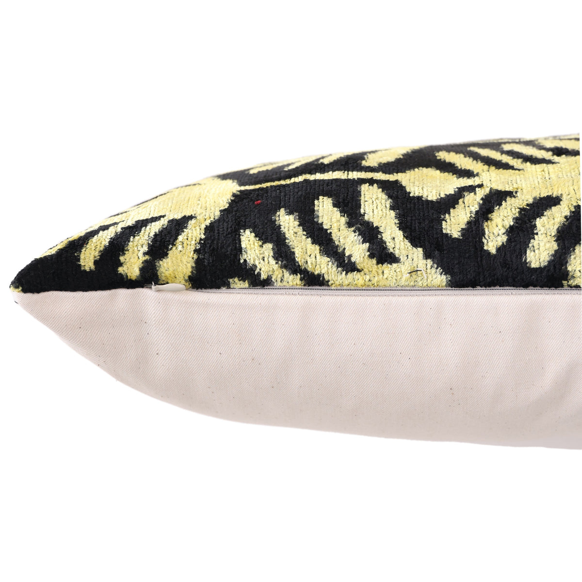Close-up along the edge showing the hidden zipper seam in chartreuse gold and black velvet