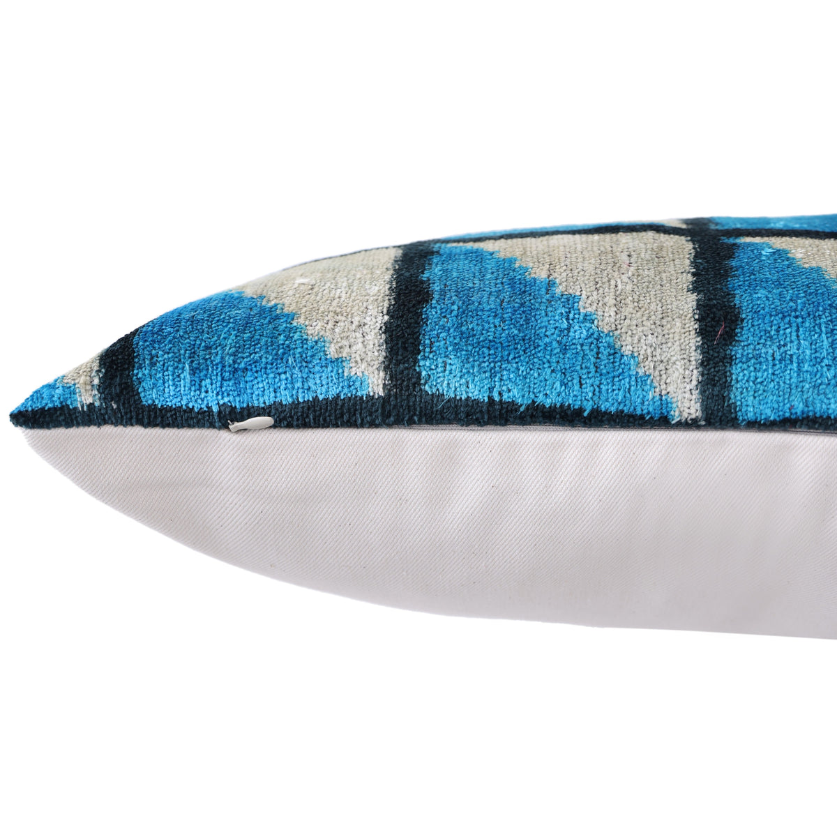 Edge detail showing hidden zipper on geometric silk velvet lumbar pillow