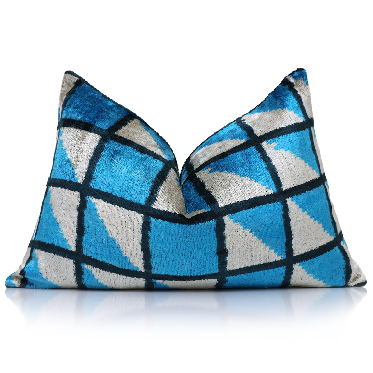 Cerulean blue geometric lumbar pillow with center karate chop crease