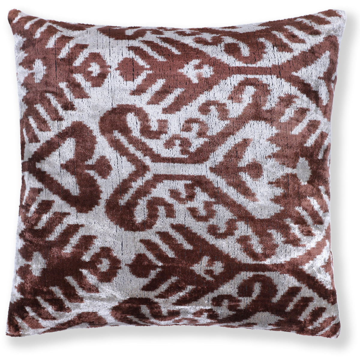 Front view of a square warm brown and silvery white ikat geometric velvet pillow on white