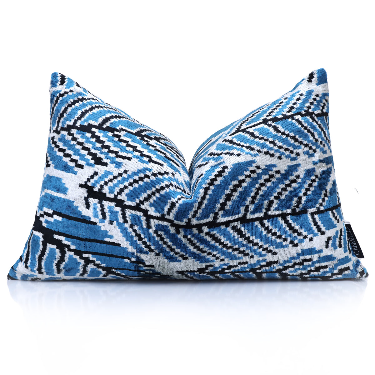 Cerulean and white ikat lumbar pillow styled with a center karate chop
