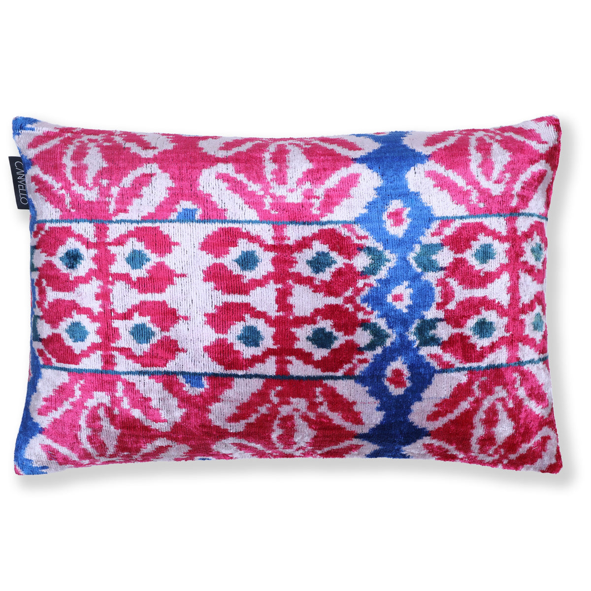 Magenta pink, white, cobalt blue and deep teal ikat lumbar pillow on a white background
