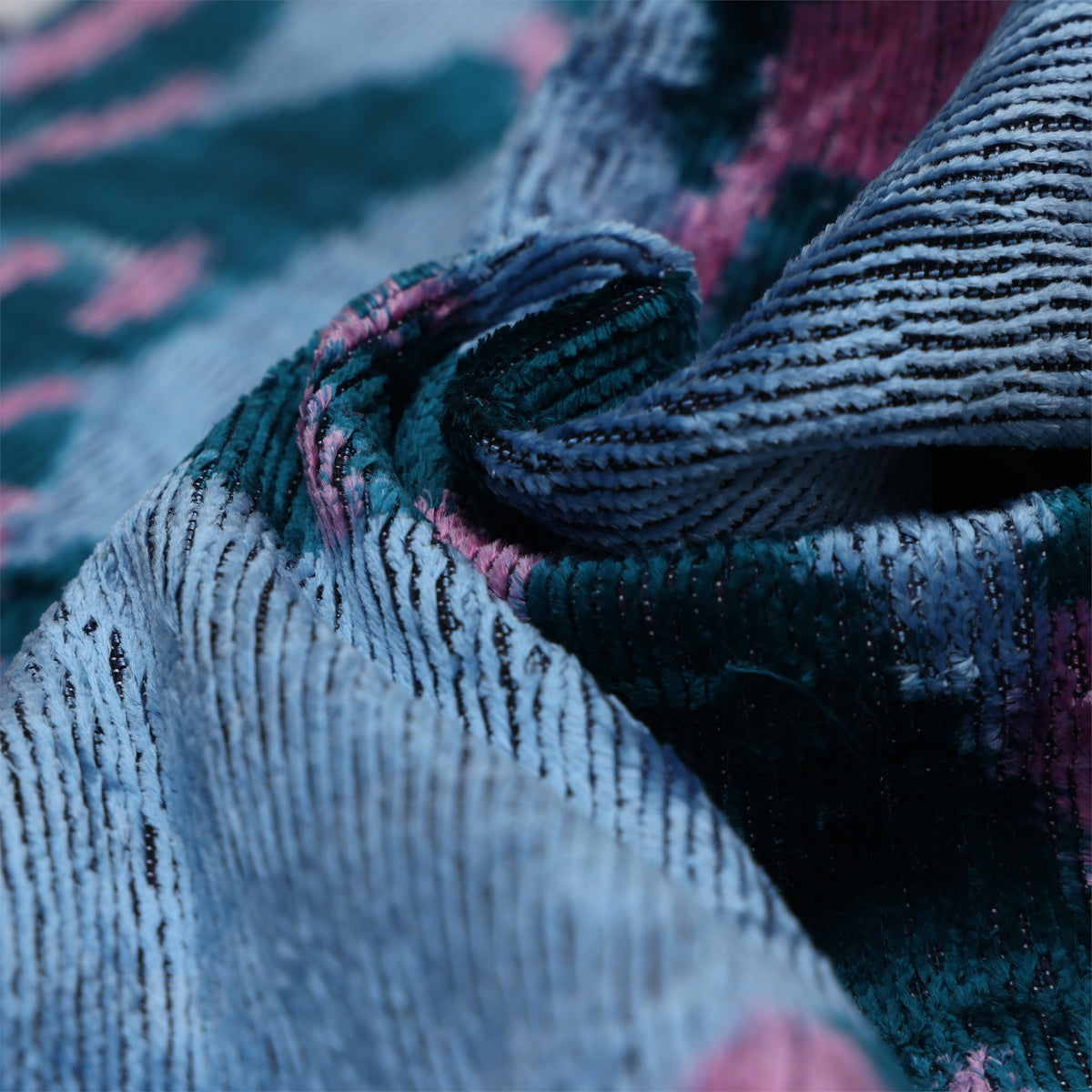 Folded ice blue velvet corner showing ribbing and changing silk sheen