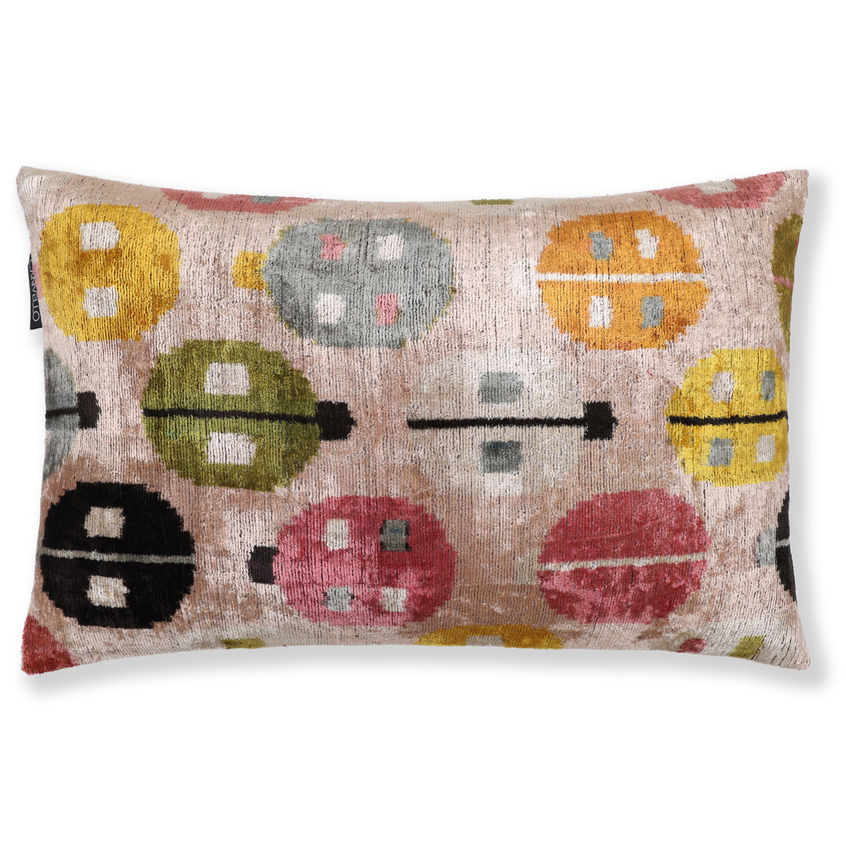Pale blush beige lumbar pillow with multicolor geometric circular medallions on a white background
