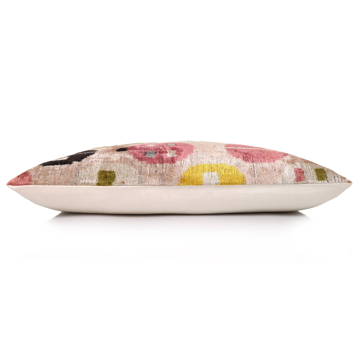 Side profile of a 16 x 24 lumbar pillow with pale blush beige geometric velvet face