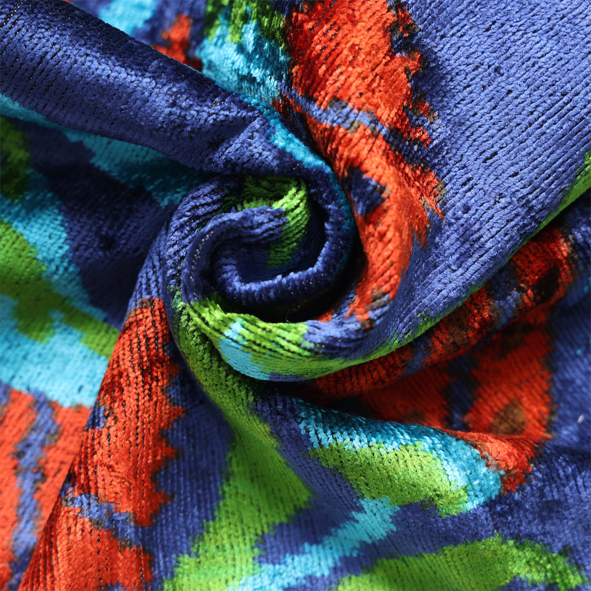 Tight swirl highlighting silk velvet pile sheen with deep blue, red-orange, green and turquoise colors
