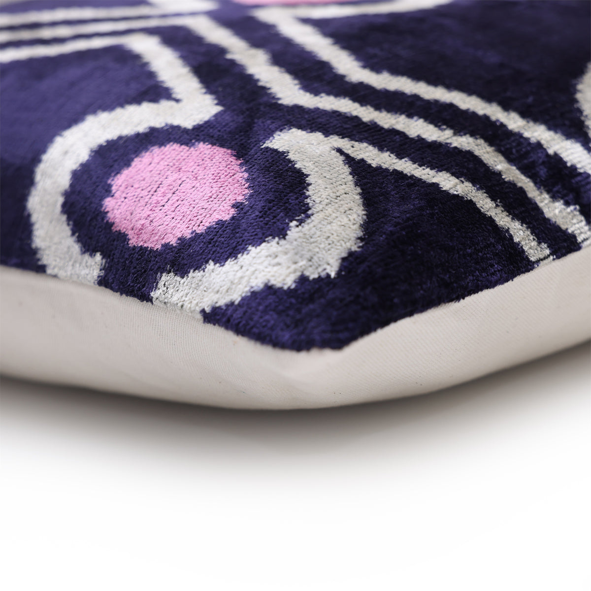 Corner seam showing deep indigo purple velvet, white backing and tailored construction
