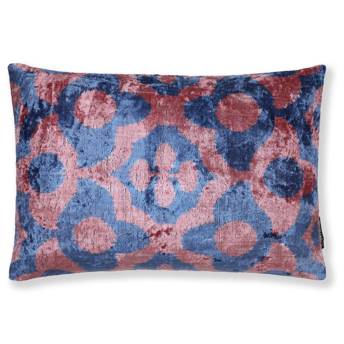 Slate blue and dusty rose pink geometric ikat motif on a velvet lumbar pillow