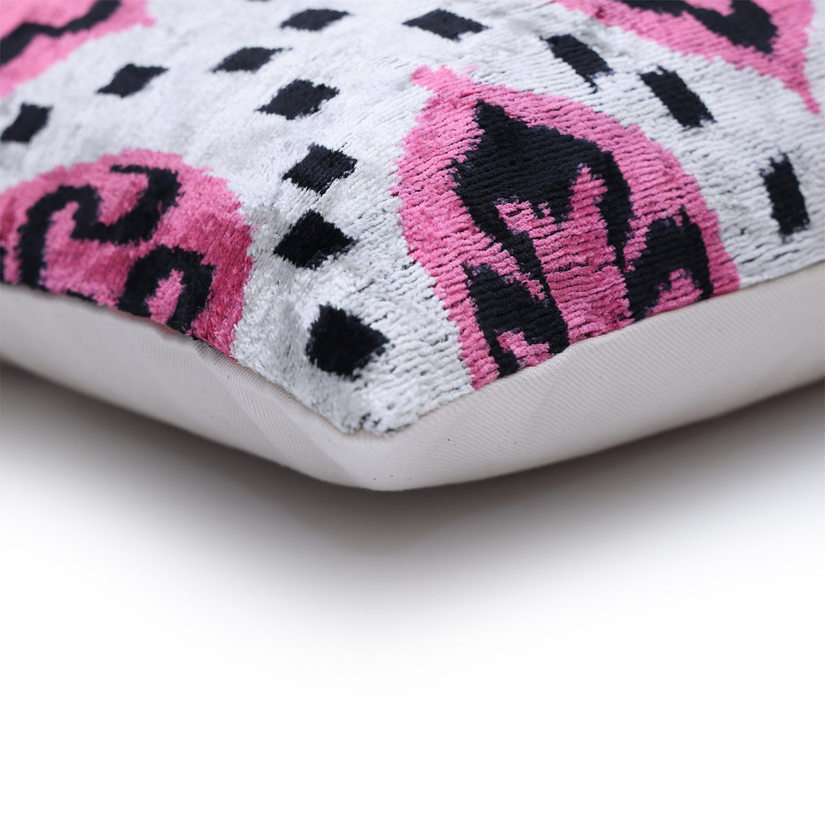Corner detail showing the patterned velvet face and solid backing edge