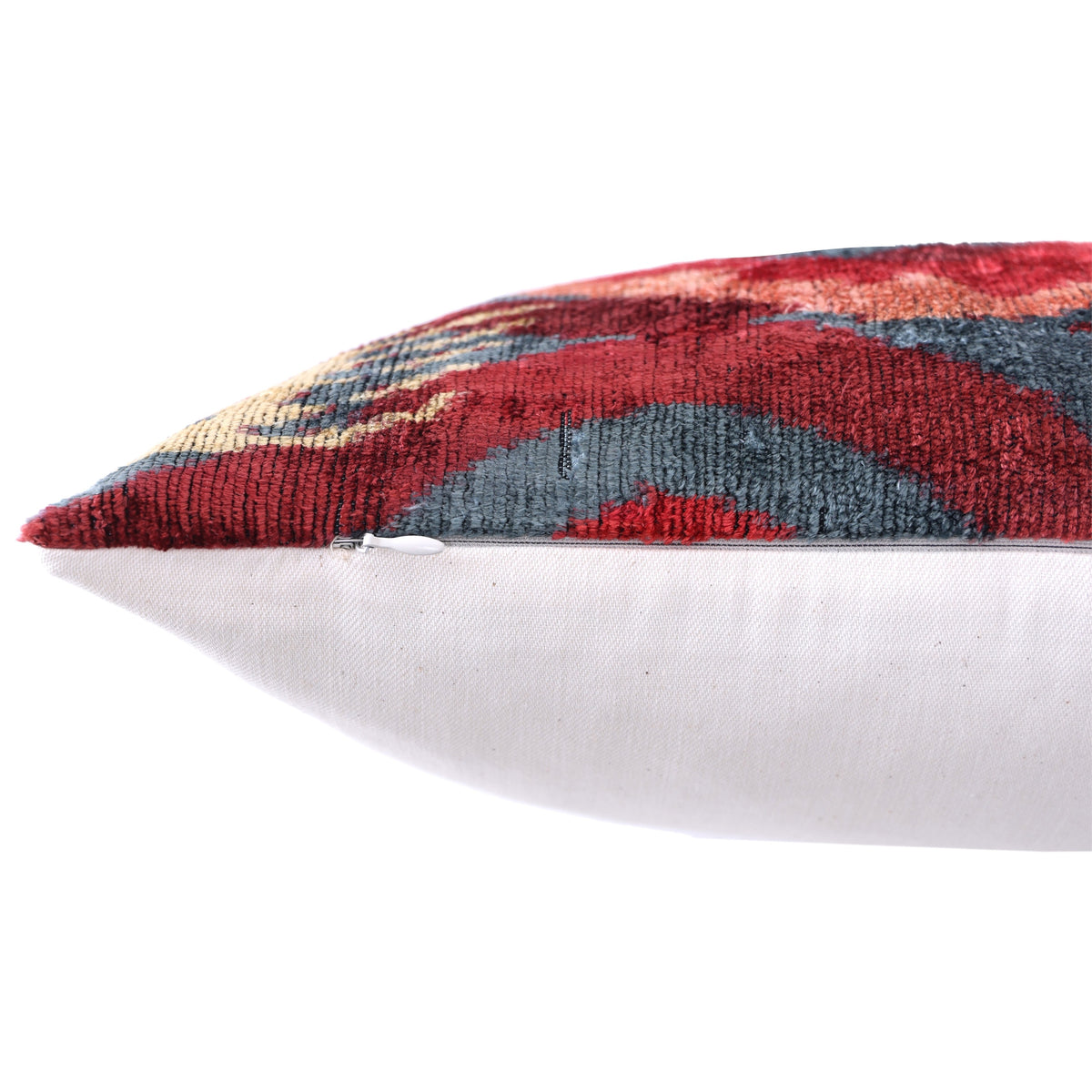 Edge view showing the concealed zipper along the velvet and linen seam