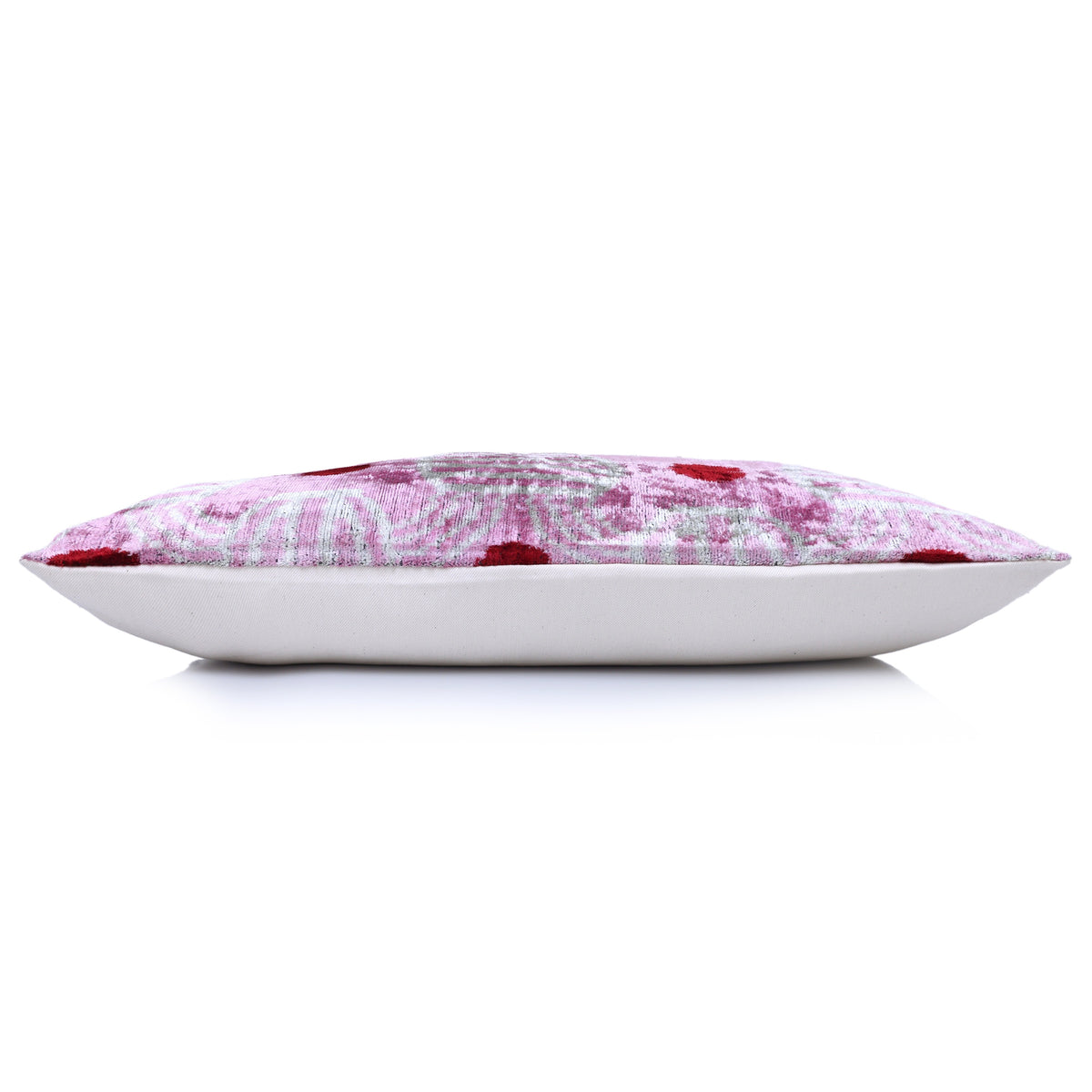 Side profile of rectangular lavender pink lumbar pillow showing flat shape and soft white back