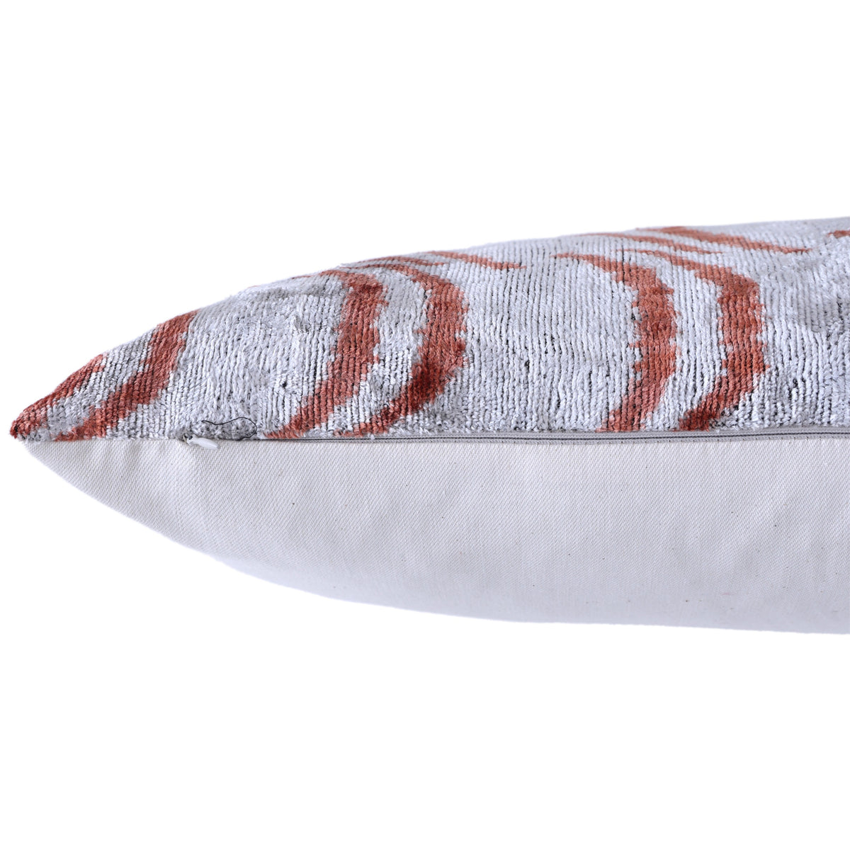 Close-up of hidden zipper closure and seam on the silver gray velvet pillow