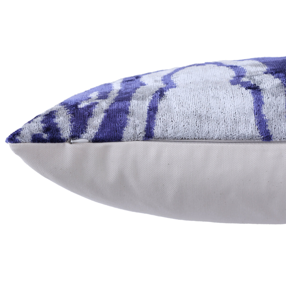 Close-up of side seam and hidden zipper on cobalt blue velvet pillow