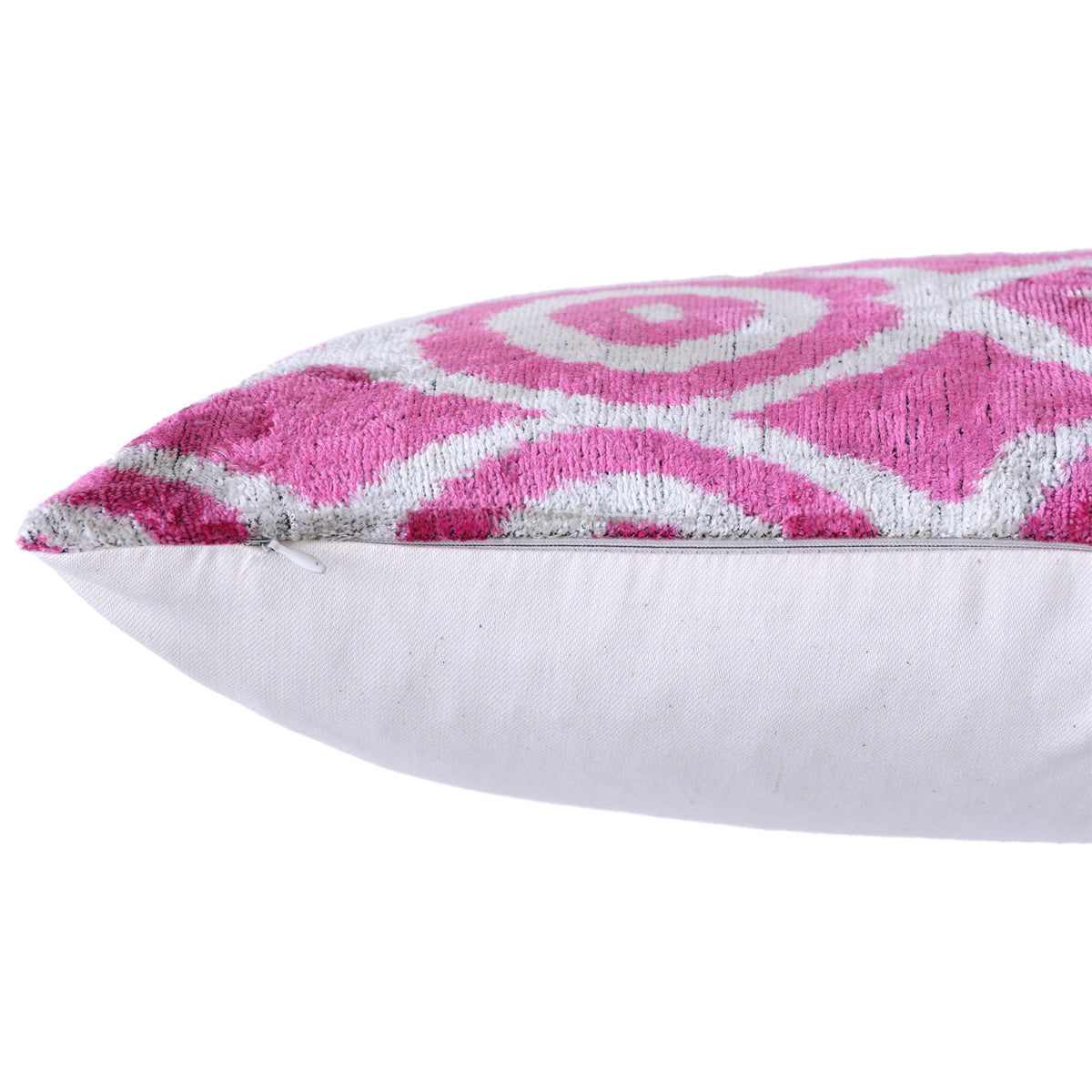 Side seam close-up of fuchsia pink ikat velvet showing hidden zipper closure