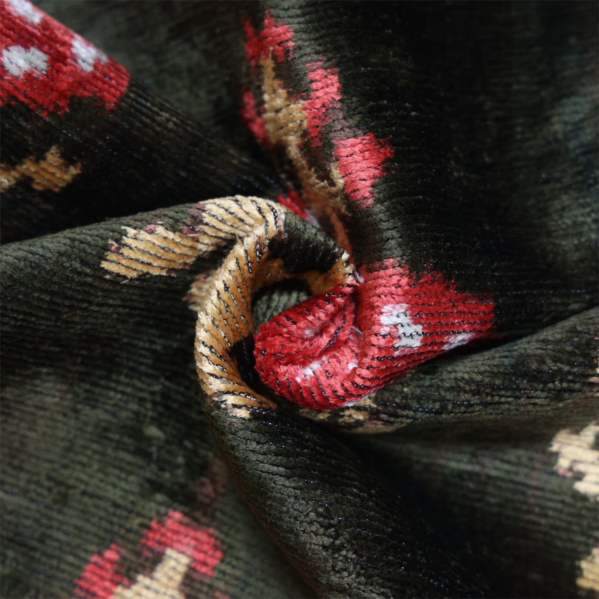 Twisted velvet detail highlighting ribs, pile and crimson red ikat passages
