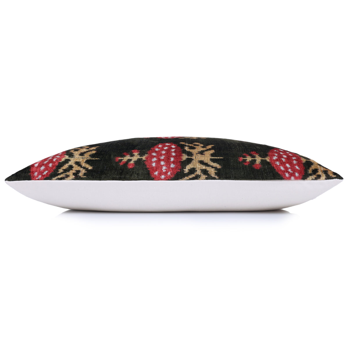 Side profile of the ikat lumbar pillow showing its edge and linen backing