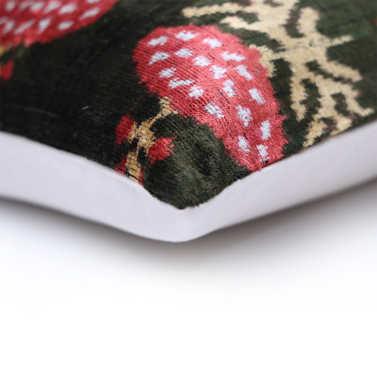 Corner detail showing the seam, dark olive green velvet and linen backing