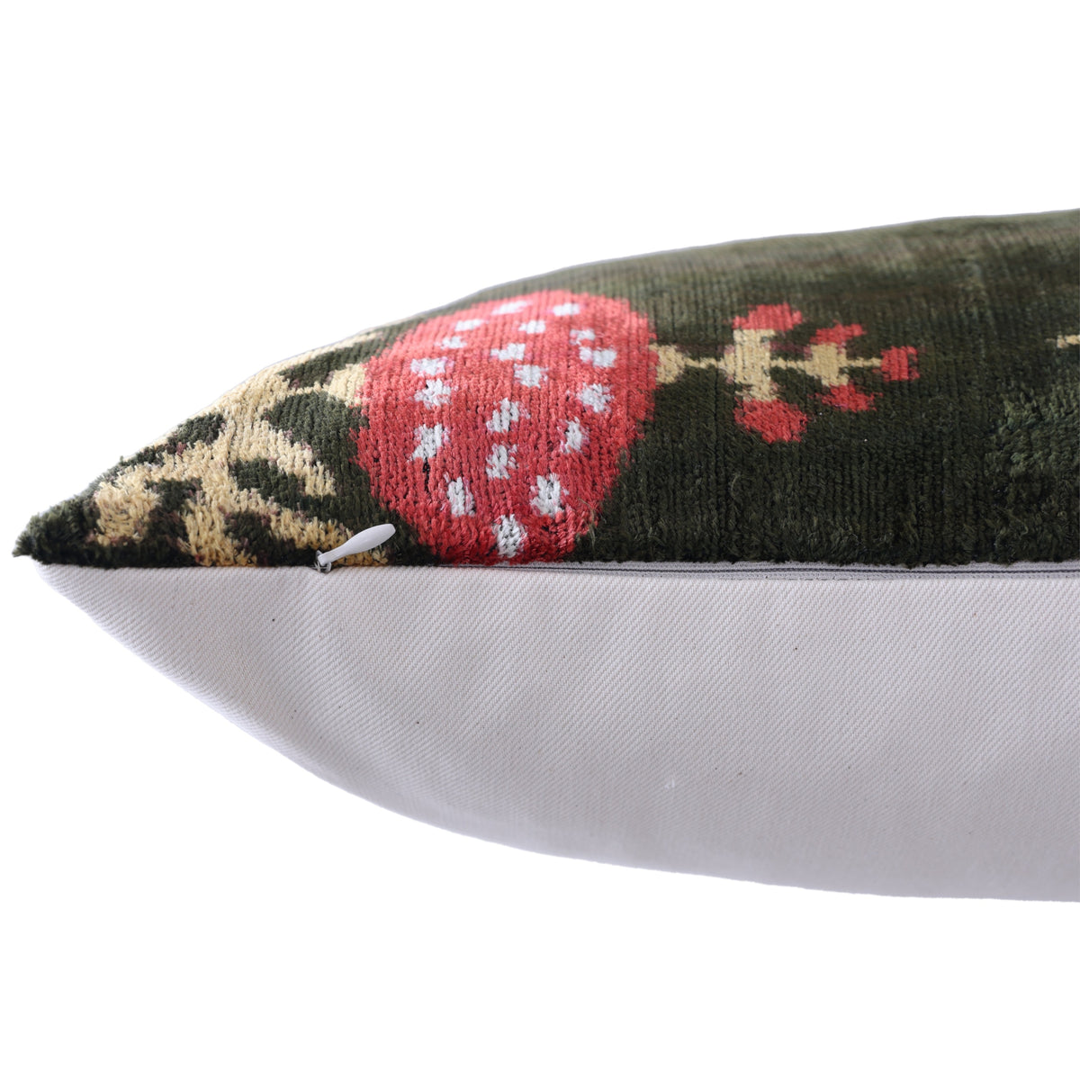 Edge seam detail with the hidden zipper pull on the ikat velvet pillow