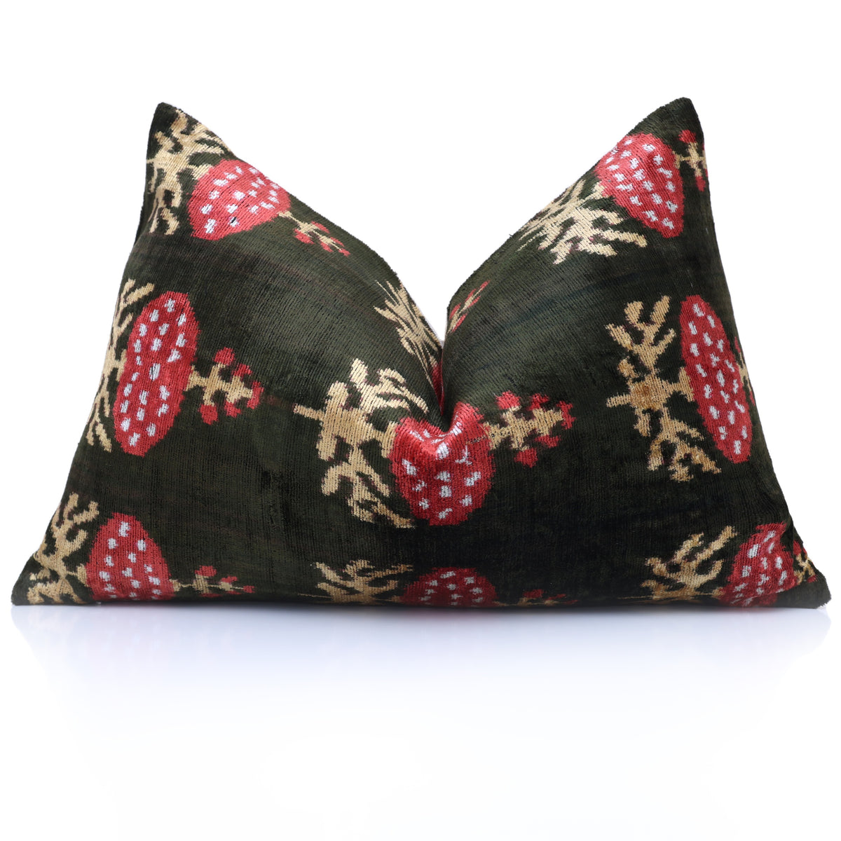 Dark olive green and crimson red ikat lumbar pillow styled with a karate chop