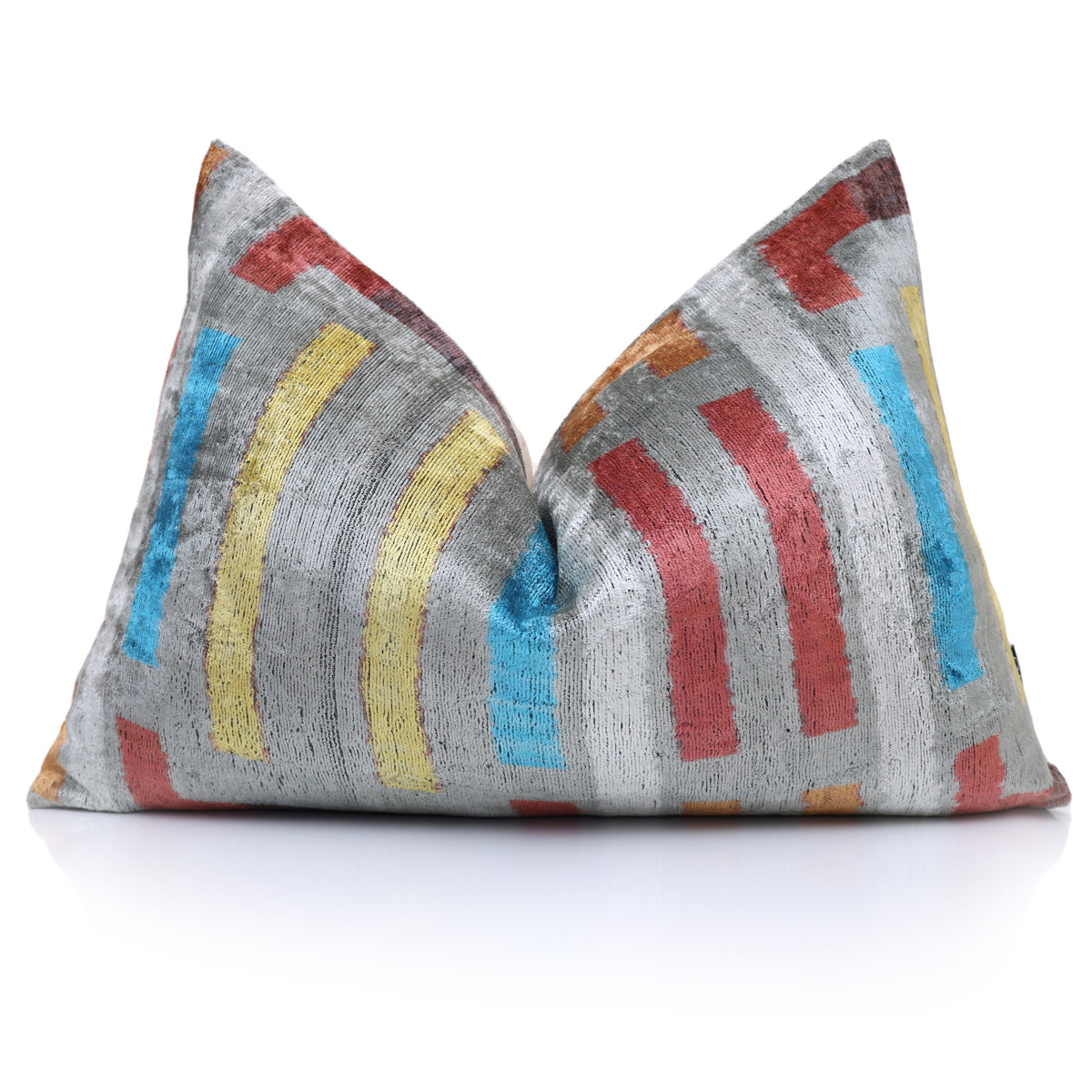 Silver gray geometric lumbar pillow styled with a central karate chop