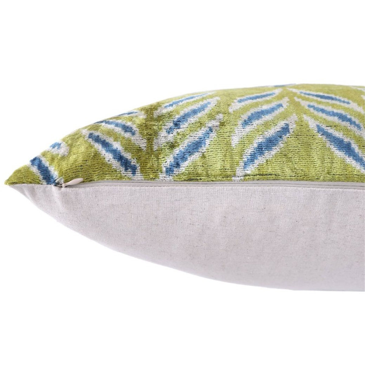 Edge close-up showing hidden zipper seam on olive chartreuse green ikat velvet