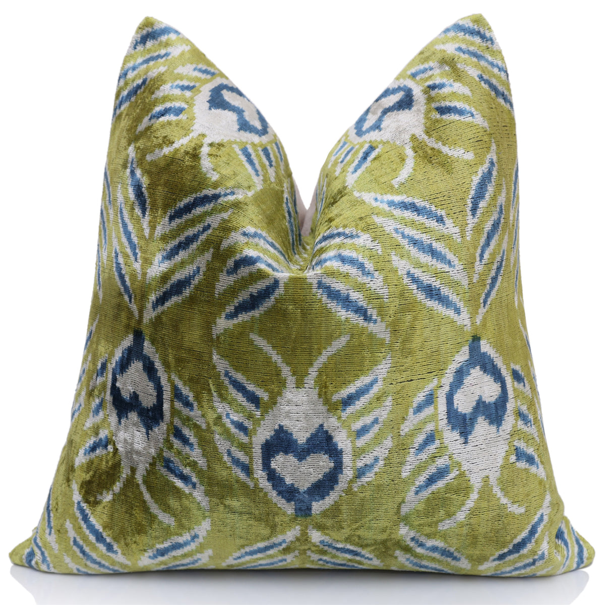 Front view of olive chartreuse green and blue ikat pillow with a karate chop fold