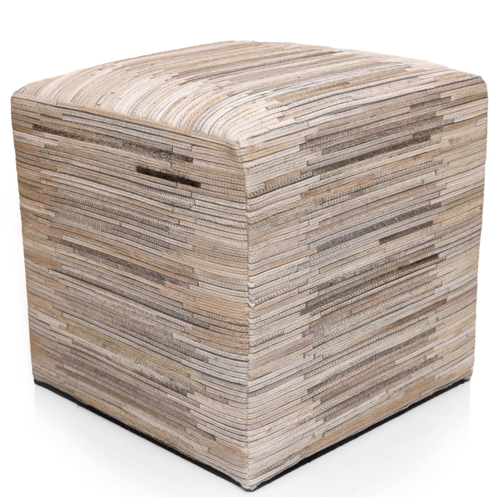 Cube-shaped ottoman with a striped pattern on a white background
