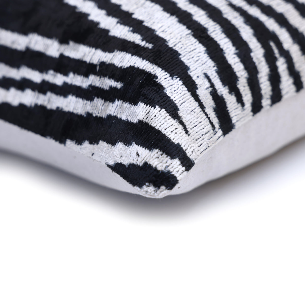Corner detail showing zebra velvet front, edge, and linen back fabric