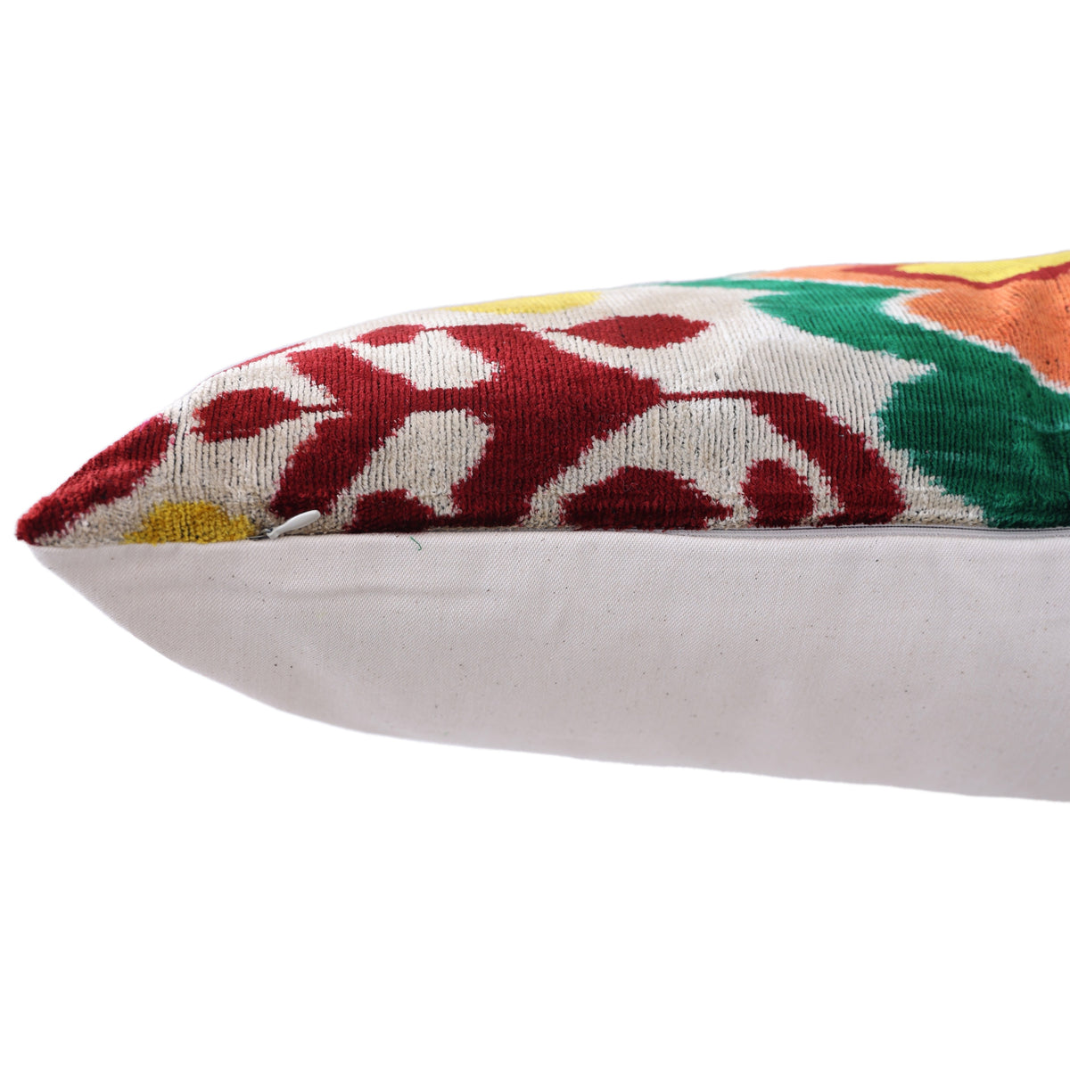 Edge detail showing hidden zipper on silvery ivory ikat lumbar pillow