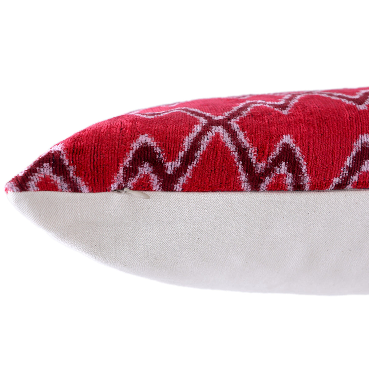 Side seam detail with hidden zipper on cherry red silk velvet pillow