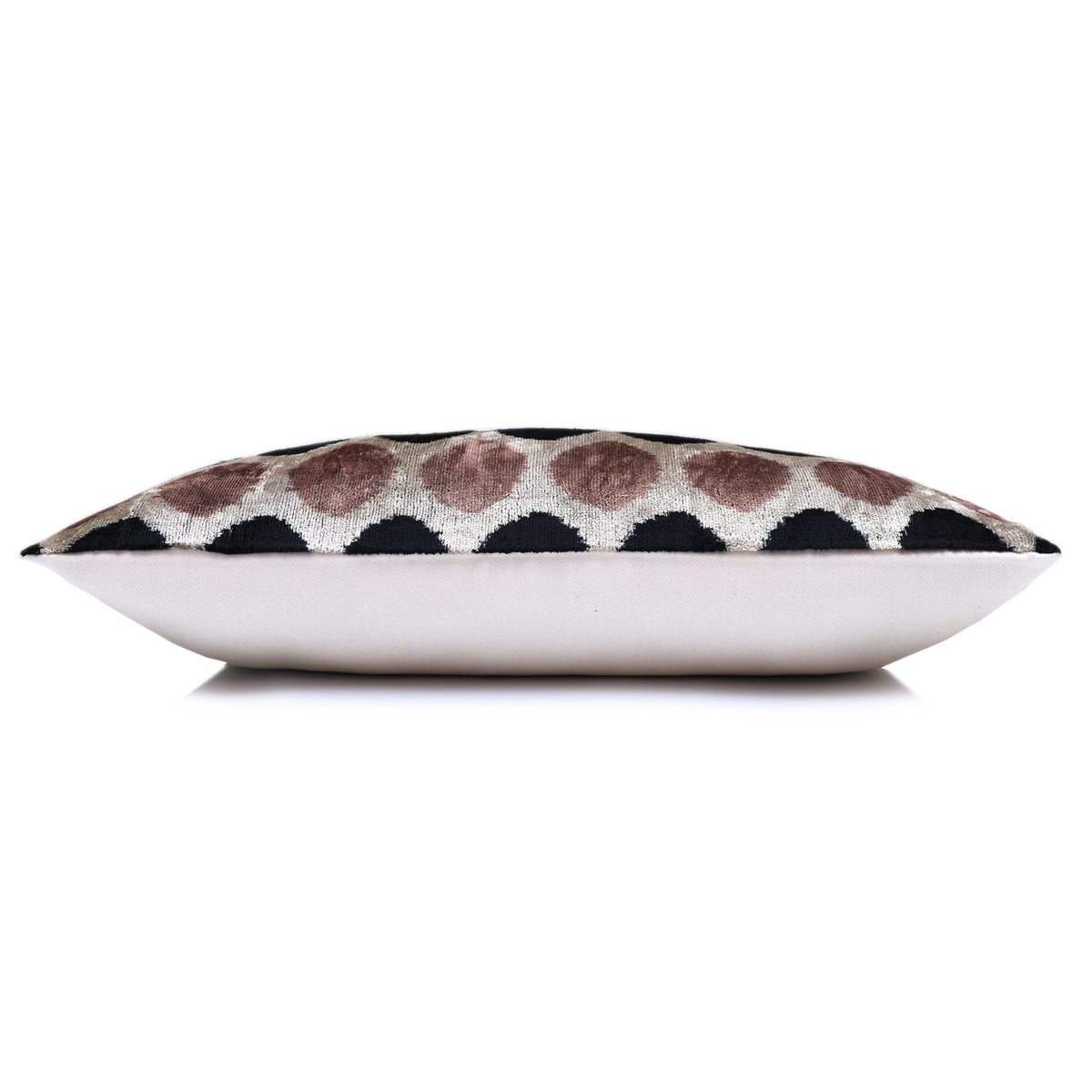Side profile of a full lumbar pillow with light champagne beige backing
