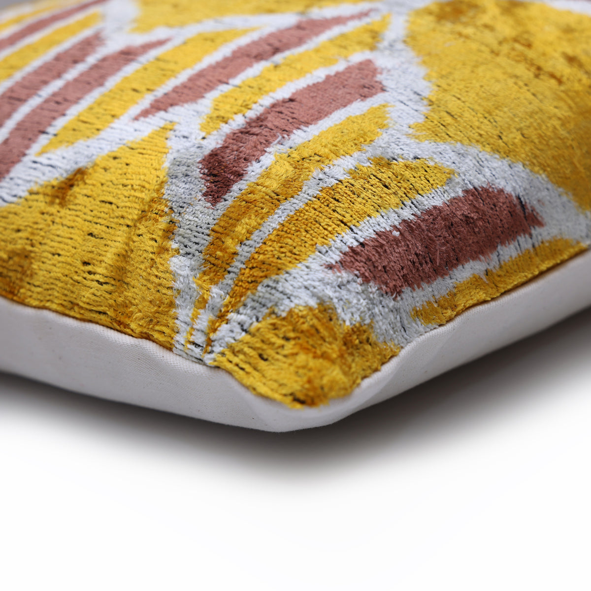 Corner detail of mustard gold velvet front with linen backing edge