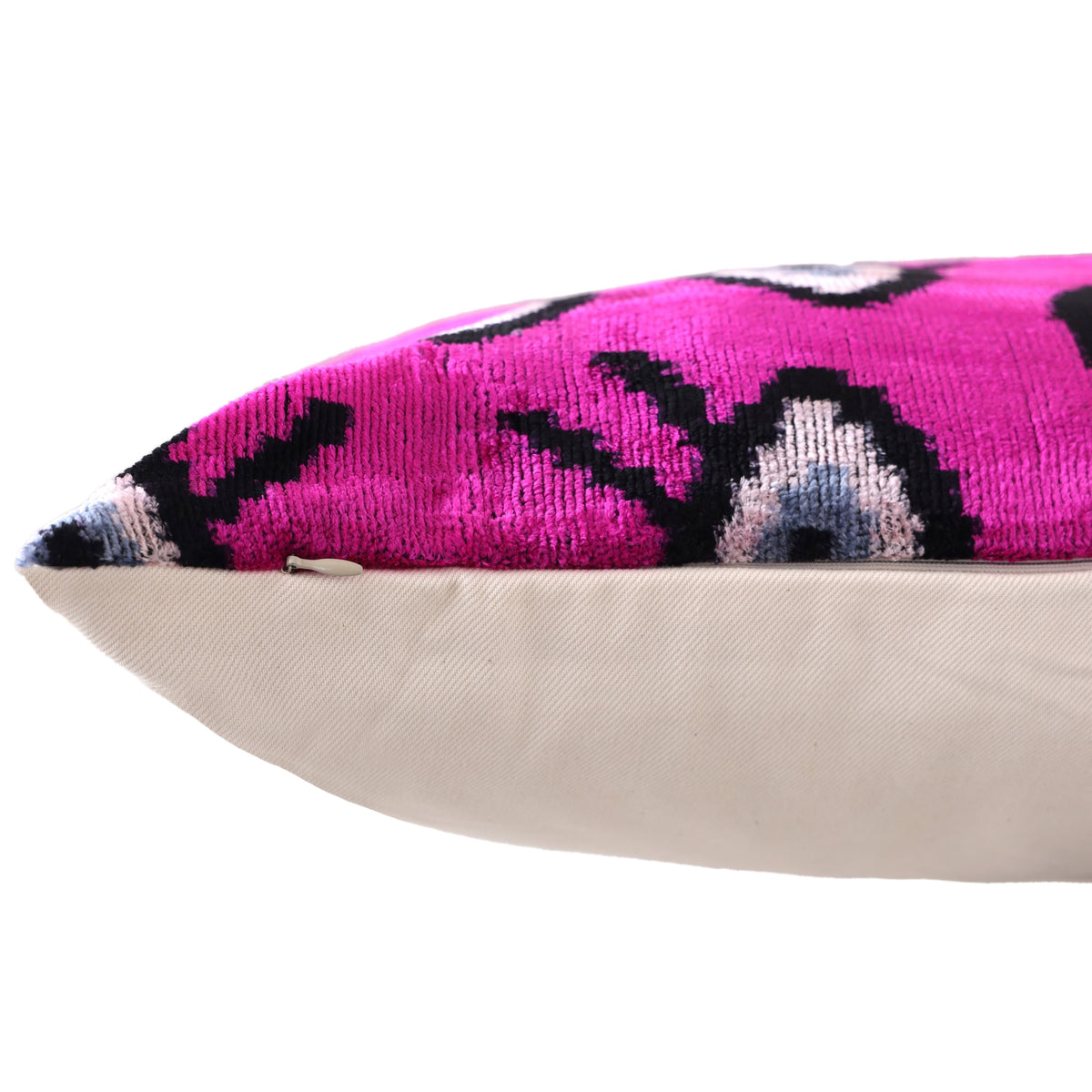 Close-up of magenta pink velvet corner with hidden zipper seam