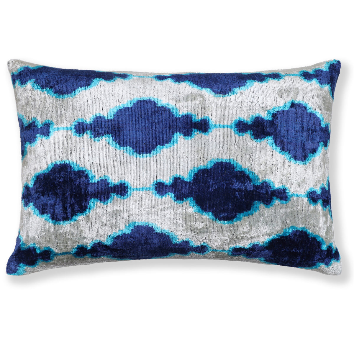Silvery white lumbar pillow with cobalt royal blue and bright turquoise blue ikat medallions