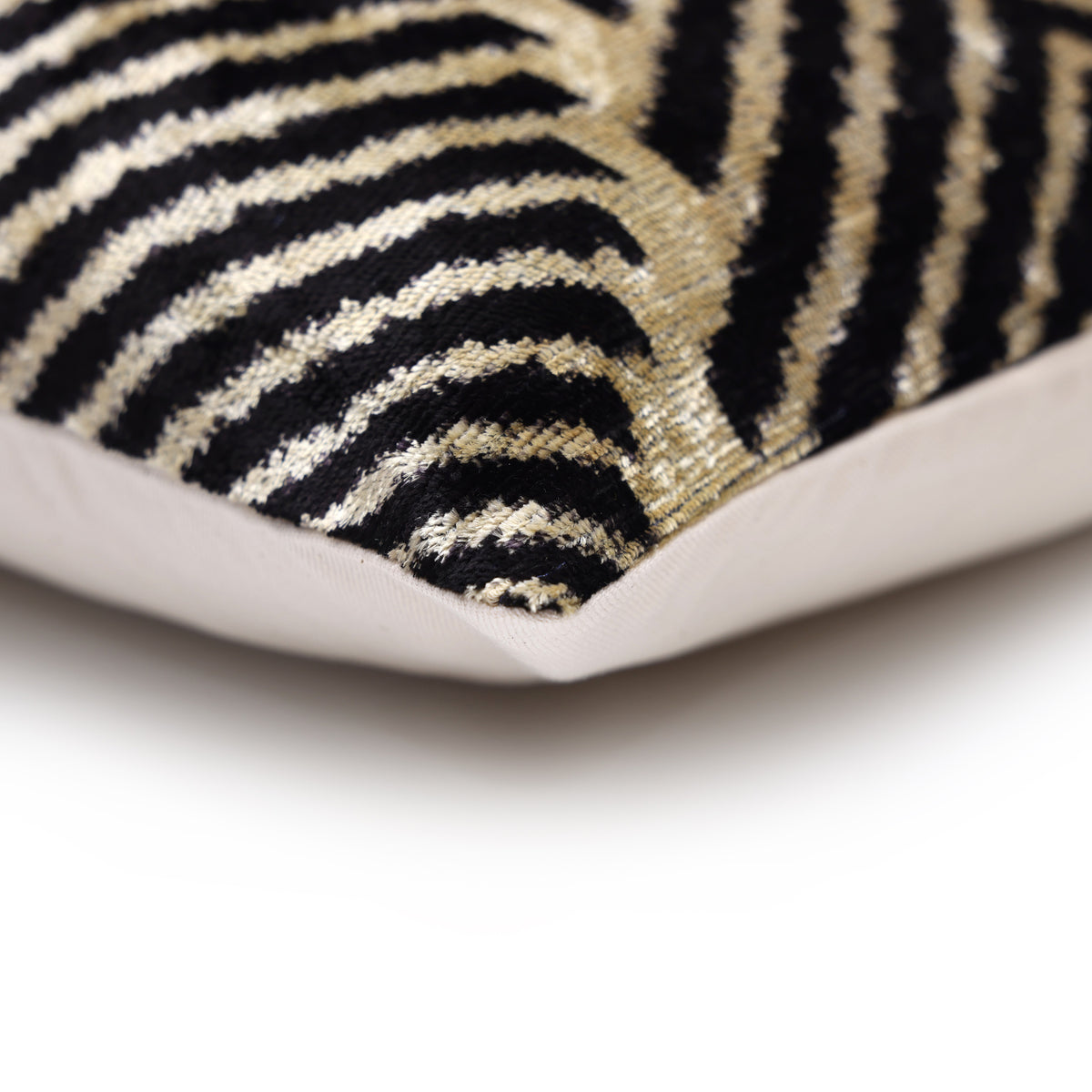 Corner detail showing chevron velvet front and plain light linen backing