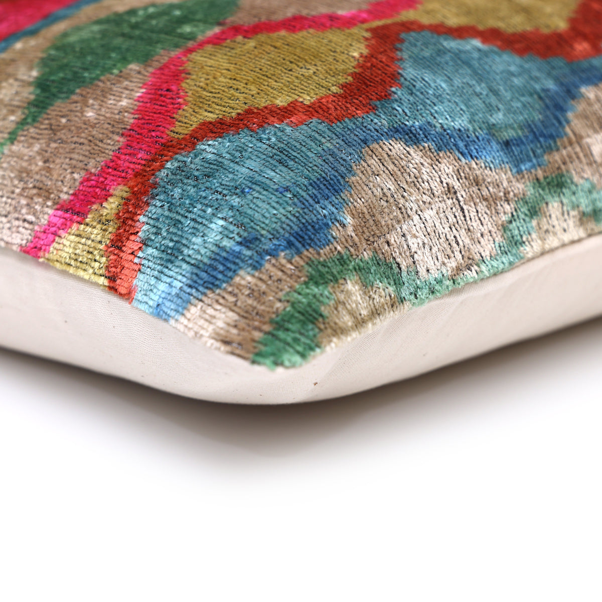 Corner detail shows multicolor wavy ikat velvet seam and plain linen backing